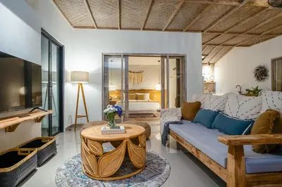a living room with a couch and a table at Villa Aarna - Tropical Chic Private Oasis in Seminyak in Seminyak