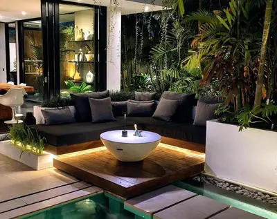 a living room with a couch and a bowl in the middle at Villa Naura Umalas in Dalung