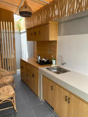 a kitchen with a sink and a counter top at Queen’s Villa in Seminyak