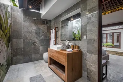 a bathroom with a sink and a mirror at Villa Iris in Dalung