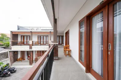a balcony with a view of a house at RedDoorz Plus at Yasa's Living Denpasar in Sanur