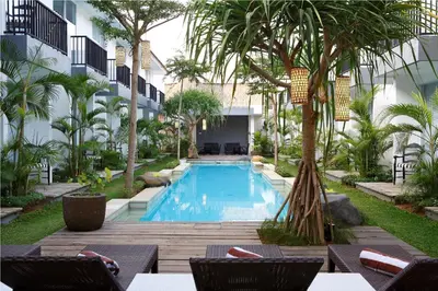 a swimming pool in the middle of a resort at 7 Bidadari Hotel Seminyak in Seminyak