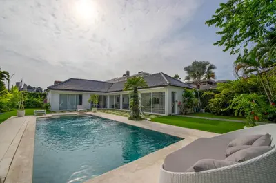 a swimming pool in the backyard of a house at Villa Vulla in Seminyak