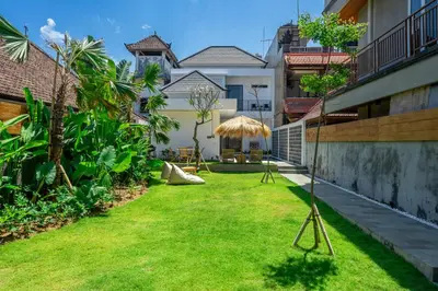 a lawn in the backyard of a house at New Modern Villa in Bali in Legian