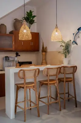 a kitchen with a table and four chairs at Umah Kita Villa in Seminyak