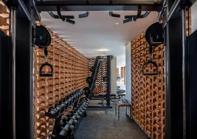 a wine cellar with a wall of wine racks at Mokko Suites Batubelig in Canggu
