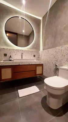 a bathroom with a toilet and a mirror at Akhila 3 - 2 BR Modern tropical villa at the heart of Seminyak in Seminyak