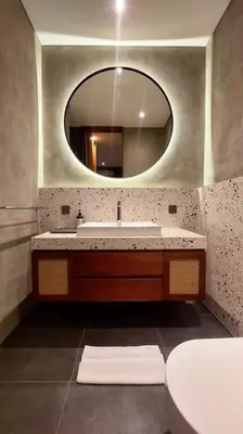 a bathroom with a sink and a mirror at Akhila 3 - 2 BR Modern tropical villa at the heart of Seminyak in Seminyak