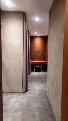 a hallway with a room with a table and a curtain at Akhila 3 - 2 BR Modern tropical villa at the heart of Seminyak in Seminyak