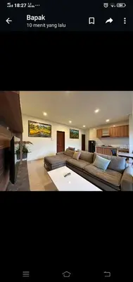 a living room with a large couch in a room at Apartment Wayan in Canggu