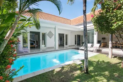 a swimming pool in the backyard of a villa at Modern villa near Atlas beach club & beach in Canggu