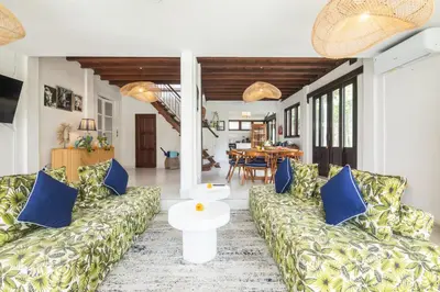 a living room with couches and a table at Monroe 3BR Luxury Villa Seminyak BREAKFAST INCL Netflix Private Pool 900m to Beach in Seminyak