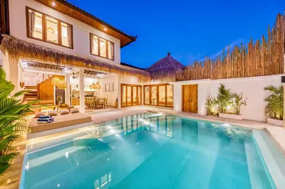 a swimming pool in the backyard of a house at Villa Waikiki - Brand New 4BDR with huge Pool in Seminyak