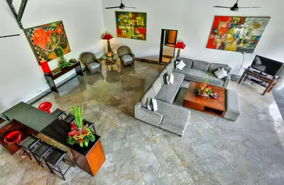 an overhead view of a living room with a couch and a table at Villa Taksu Legian in Legian