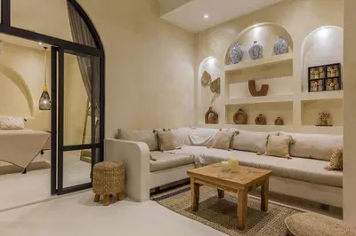 a living room with a couch and a table at VILLA SALEYA with JACUZZI in Canggu