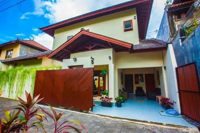 a house with a fence in front of it at Vibrant Getaway in Seminyak: Villa Buyaya in Seminyak