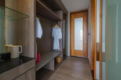 a corridor of a bathroom with a closet and a door at Beyond The Sea - Luxe Sea View Villa in Jimbaran in Jimbaran