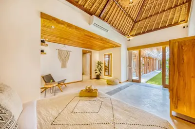 a living room with a rug on the floor at Villa Tango - New Luxurious 7BDR Prime Location in Seminyak