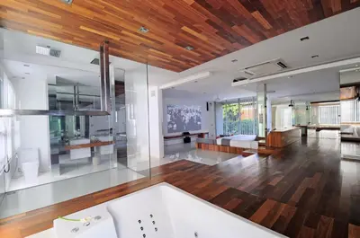 a large bathroom with a tub and a wooden ceiling at 4BR Villa Minggu - Minggu Villas Seminyak in Seminyak