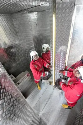a group of firefighters sitting in a net at 4BR Villa Minggu - Minggu Villas Seminyak in Seminyak