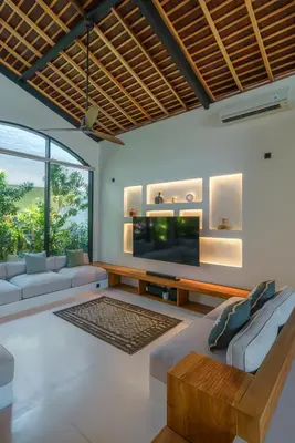 a living room with a large flat screen tv at Casa Donilo - 4BR Designer Villa in Canggu in Canggu