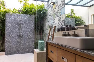 a bathroom with a sink and a shower at Villa Cantik in Canggu