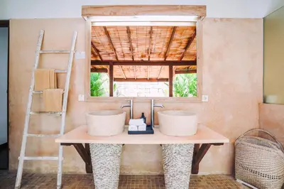 a bathroom with a sink and a mirror at Villa Cira - 5 Bedrooms Private Villa Next to Seminyak in Seminyak