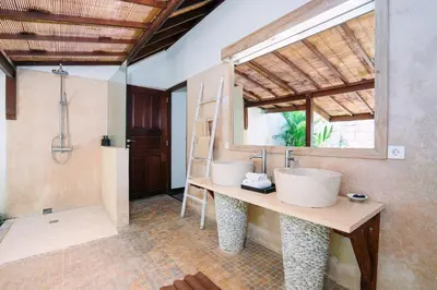 a bathroom with two sinks and a shower at Villa Cira - 5 Bedrooms Private Villa Next to Seminyak in Seminyak