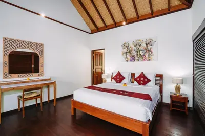 a bedroom with a bed and a desk and a bed at Villa Cira - 5 Bedrooms Private Villa Next to Seminyak in Seminyak