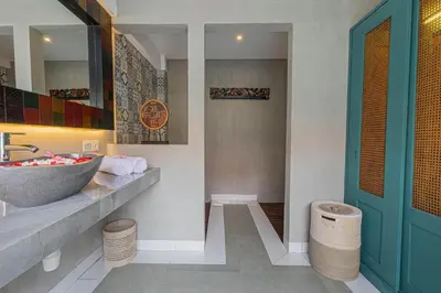 a bathroom with a sink and a counter with a sink at Mezzanine Industrial 1 Bedroom Private Villa in Seminyak in Seminyak