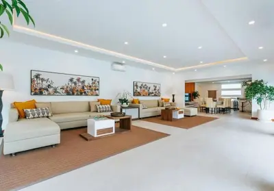 a large living room with couches and tables at Spacious 4 Bedroom Private Villa in buzzy of Seminyak in Canggu