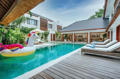 a swimming pool with a inflatable unicorn in a house at Spacious 4 Bedroom Private Villa in buzzy of Seminyak in Canggu