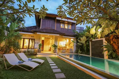 a villa with a swimming pool and a house at Private villa with pool near 66 in Seminyak in Seminyak