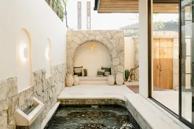 a koi pond in the middle of a house at VILLA HAWILA 2BR OBEROI SEMINYAK PRIME LOCATION - No FLOOD in Seminyak