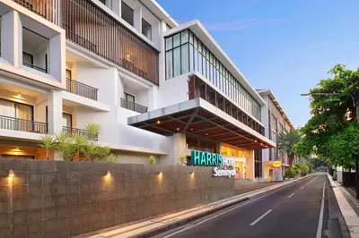 an empty street in front of a building at HARRIS Hotel Seminyak in Seminyak