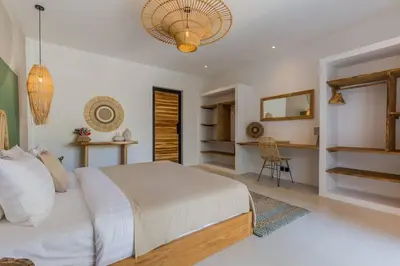 a bedroom with a bed and a desk in it at Villa Alamanda Livia Seminyak Design spacious 2bdr and private pool in Seminyak