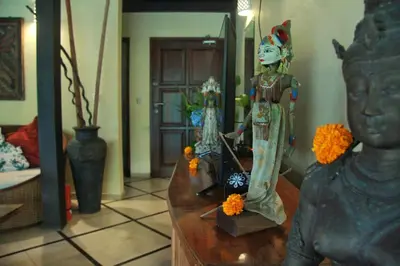 a statue of a woman on a table in a room at Villa Yauda - Charming 3BR w/Private pool & Garden in Seminyak