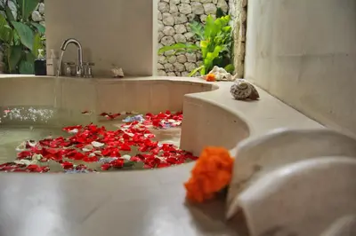 a bathroom with a bunch of red hearts on the floor at Villa Yauda - Charming 3BR w/Private pool & Garden in Seminyak