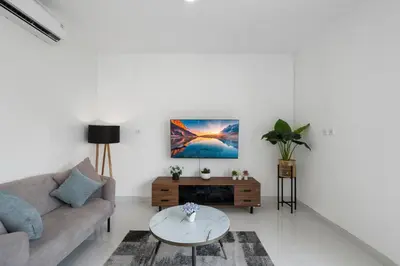 a living room with a couch and a table at Serenity Villa by Betterplace in Kerobokan
