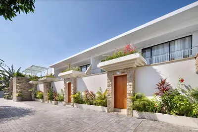 a house with plants on the side of it at Sayang Villa Bali in Kerobokan