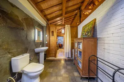 a bathroom with a toilet and a sink at Villa Arumanis in Canggu