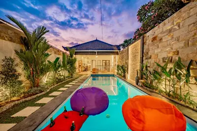 a swimming pool in the backyard of a house at Villa Domino - *NEW* Luxurious 2BR w/ Pool @Central Seminyak in Seminyak