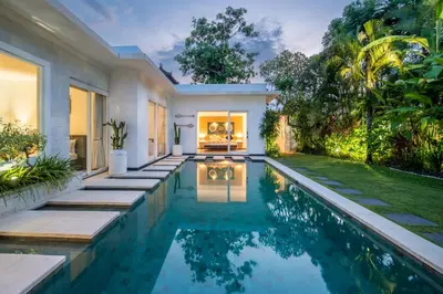 a swimming pool in the backyard of a villa at Villa Khanphi Seminyak in Seminyak