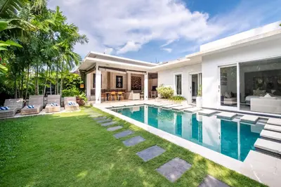 a house with a swimming pool and a yard at Villa Khanphi Seminyak in Seminyak