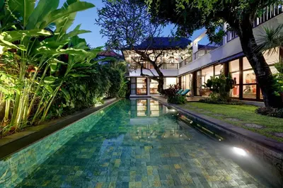 an infinity pool in the courtyard of a villa at Villa Amira 5BR Villa 17m Pool Near Legian Beach in Legian