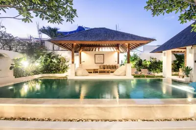 a swimming pool in a villa with a gazebo at Colonial-style 4BR Villa, 400m to Canggu Beach in Canggu