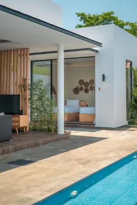 a villa with a bedroom and a swimming pool at Villa Selikur 1 - Spacious 3BR Villa in Seminyak! Perfect location! in Seminyak