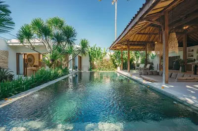 a swimming pool in the middle of a villa at Villa Marula at Bidadari in Seminyak
