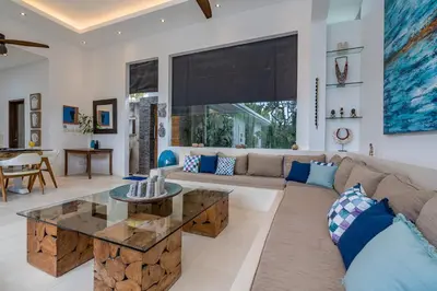 a living room with a couch and a table at Villa Celine 2 chambres piscine Seminyak BALI in Seminyak
