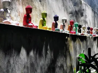 a row of colorful glass figurines on a wall at Villa Joglo Oberoi Seminyak Beautiful 4BR Villa Prime Location in Seminyak